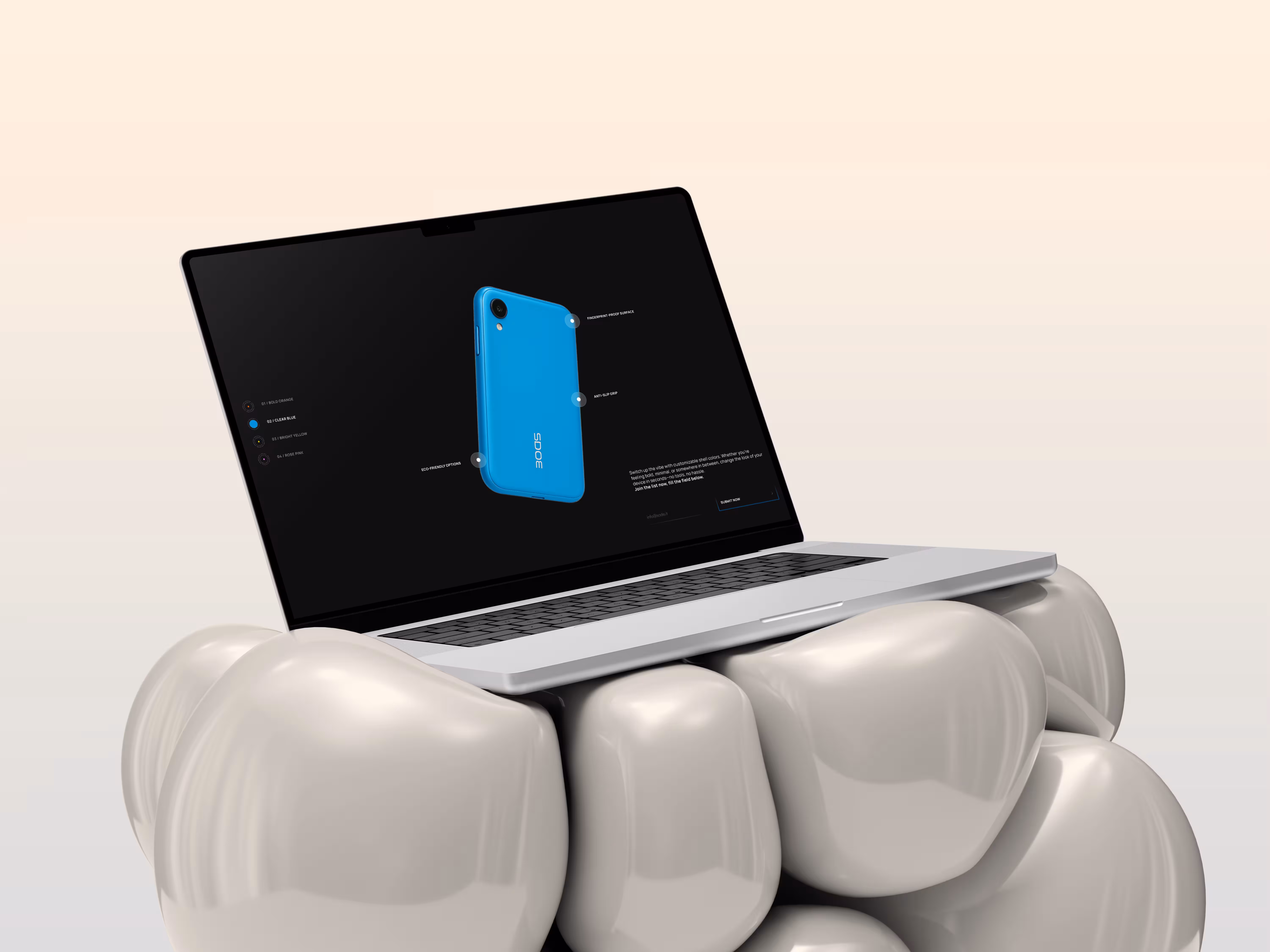Silver laptop resting on a cluster of smooth, rounded, shiny white stones against a neutral background.