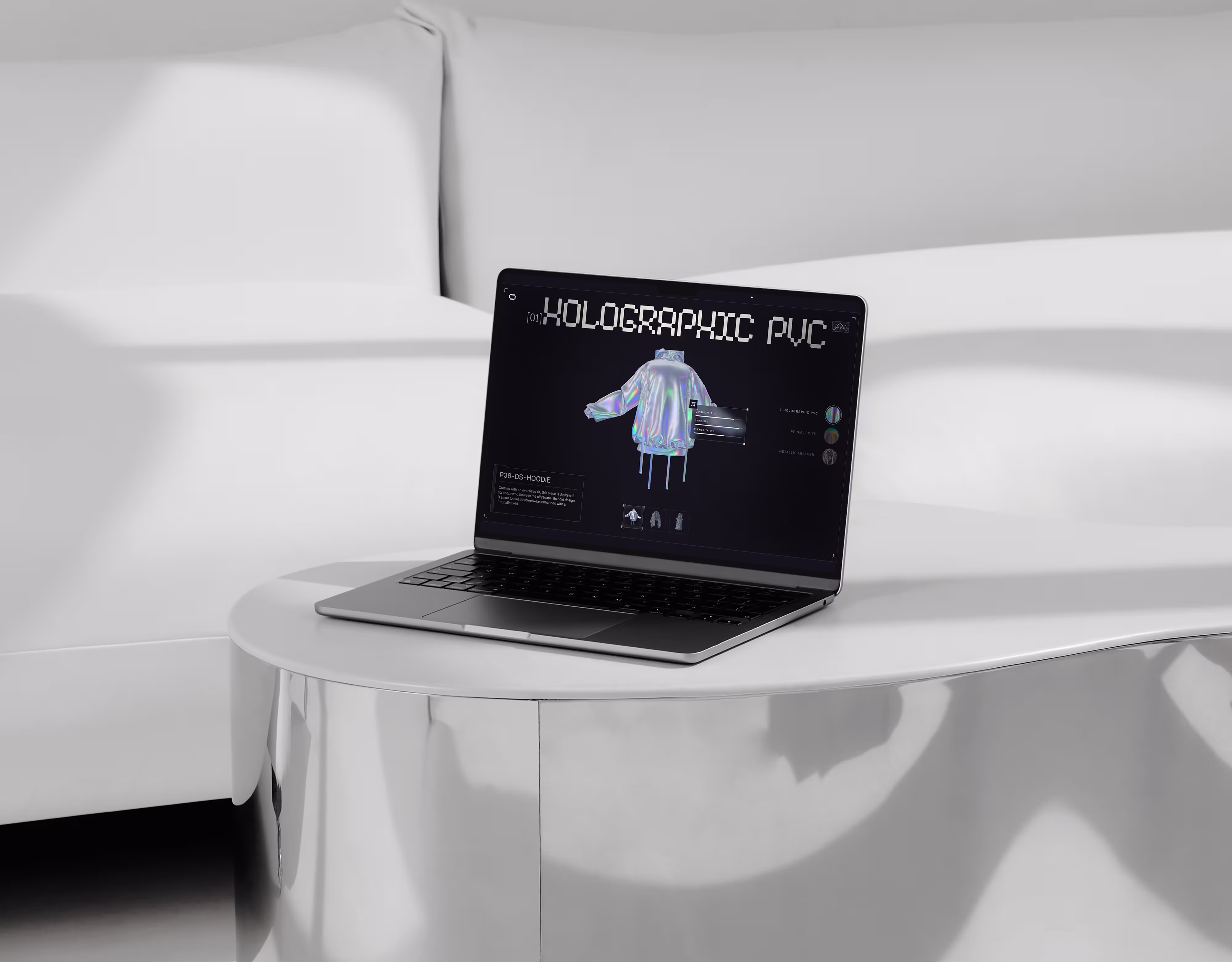 Laptop on white table displaying a holographic PVC jacket design on a black screen.